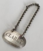 An oval Victorian silver wine label for 'Claret' w