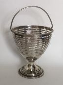 A Georgian silver swing handled basket with ball d