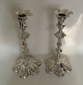 A heavy matched pair of Georgian cast silver candl