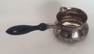 An Edwardian silver brandy pan with pouring lip an