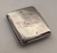 A heavy silver card case with gilt interior. Appro