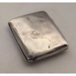 A heavy silver card case with gilt interior. Appro