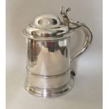 A good quality George II silver tankard with scrol