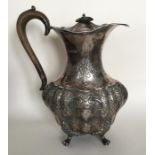 A good quality Edwardian silver water jug embossed