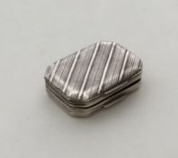 An unusual silver vinaigrette with reeded decorati
