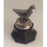 An unusual silver trophy in the form of a pigeon o