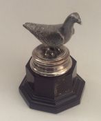 An unusual silver trophy in the form of a pigeon o