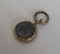A Georgian chased locket with hair centre. Approx.