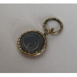 A Georgian chased locket with hair centre. Approx.