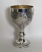 A good George III chased silver goblet with floral
