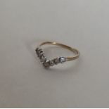 A 9 carat wishbone cluster ring. Approx. 1.5 grams