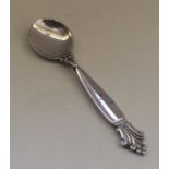 GEORG JENSEN: A stylish silver salt spoon of typic