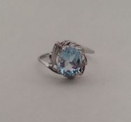 A 10 carat white gold and blue topaz ring. Approx.