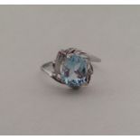 A 10 carat white gold and blue topaz ring. Approx.