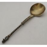 A Continental silver gilt spoon with twisted stem.