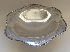 An attractive Edwardian silver sweet dish decorate