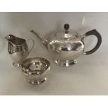 LIBERTY & CO: A rare three piece silver tea servic