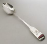 EXETER: A large fiddle pattern silver basting spoo