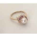 a cultured pearl and ruby seven stone ring. Approx