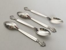 GEORG JENSEN: A set of four large silver teaspoons