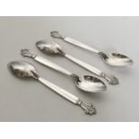 GEORG JENSEN: A set of four large silver teaspoons
