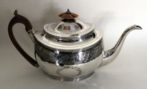 A good oval Georgian silver bright cut teapot with