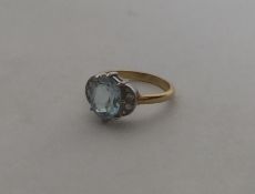 An attractive aquamarine and diamond nine stone ri