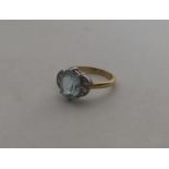An attractive aquamarine and diamond nine stone ri