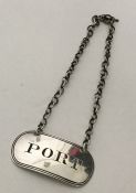 An oval Georgian silver wine label for 'Port' with