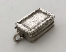 An unusual rectangular silver gilt vinaigrette wit