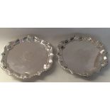 A good pair of silver salvers with crested centres