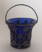 A Georgian silver basket decorated with vines. App