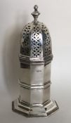 A tall silver sugar caster on spreading base. Ches