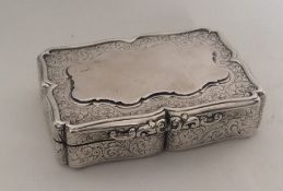 A heavy Georgian silver snuff box engraved with fl