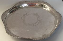 A heavy Edwardian silver two handled tray with gad