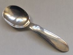 A stylish silver caddy spoon. London. By Mappin &