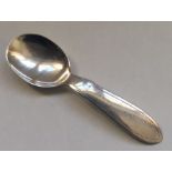 A stylish silver caddy spoon. London. By Mappin &