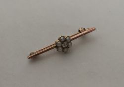 A small gold diamond and pearl brooch. Approx. 2.7