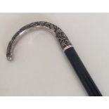 A Chinese silver walking cane of typical design. E