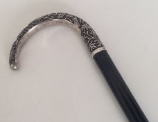 A Chinese silver walking cane of typical design. E