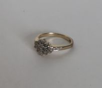 A 9 carat lozenge shaped diamond cluster ring. App