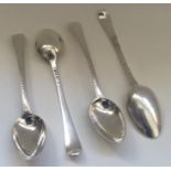 A group of four Georgian silver feather edge spoon