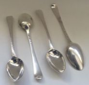 A group of four Georgian silver feather edge spoon