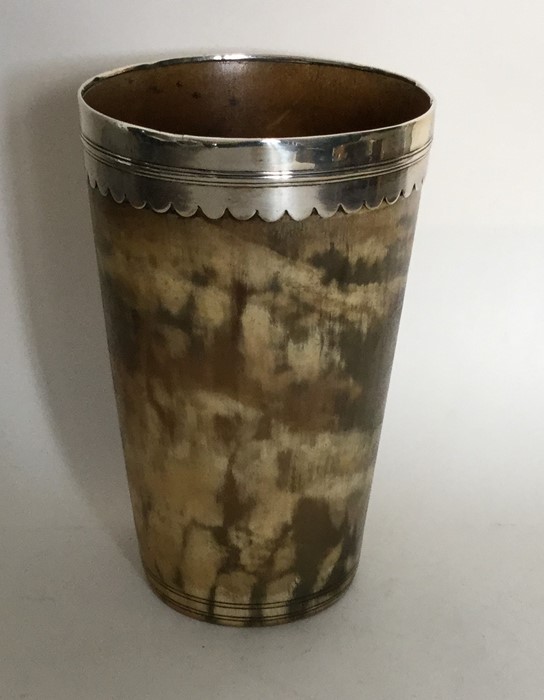 A tall Georgian silver rimmed tapering horn beaker