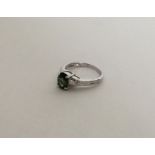 A 9 carat tourmaline set singe stone ring in 9 car