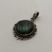 An unusual silver and stone pendant with loop top.