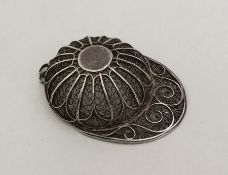 An 18th Century silver filigree caddy spoon in the