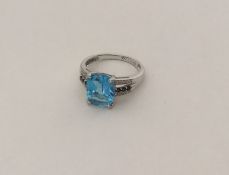 A large blue topaz, sapphire and diamond ring. App