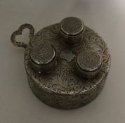 A rare finely engraved silver triple burner with e