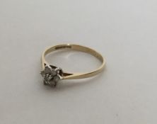 A small diamond circular cluster ring in 9 carat m